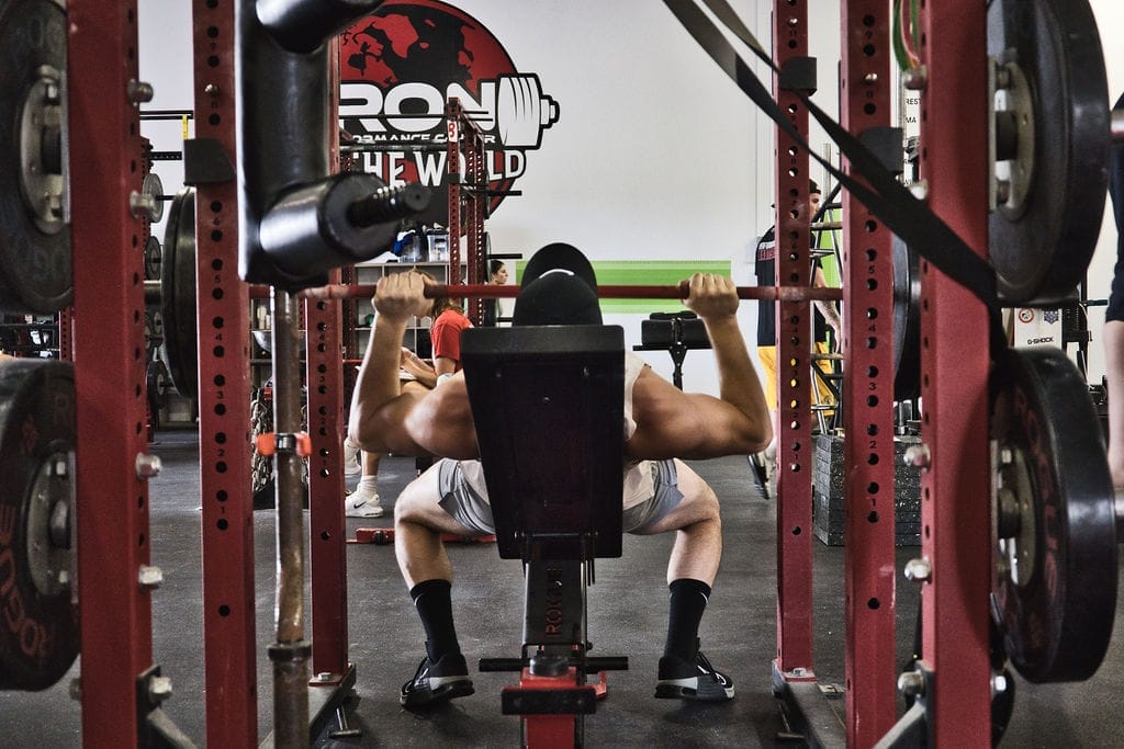 Member lifting weights at Iron Performance Center