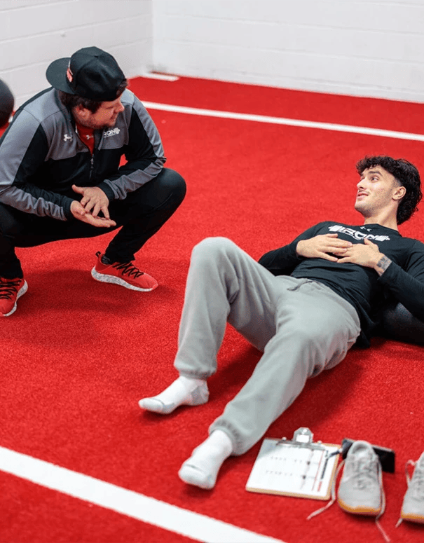 man stretching at Iron Performance Center